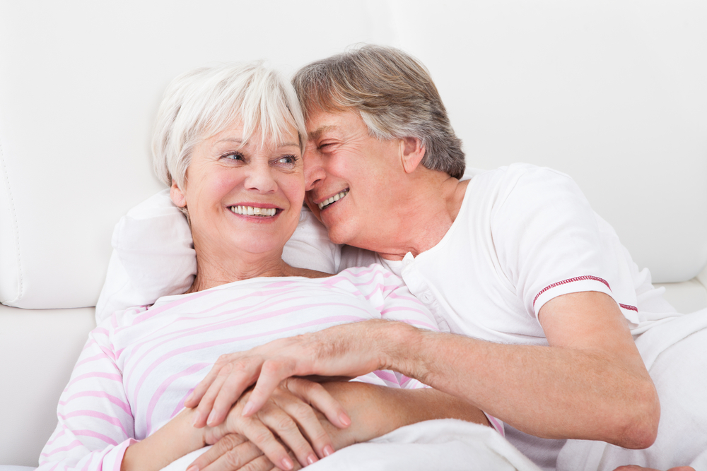older couple in bed, making love.jpg
